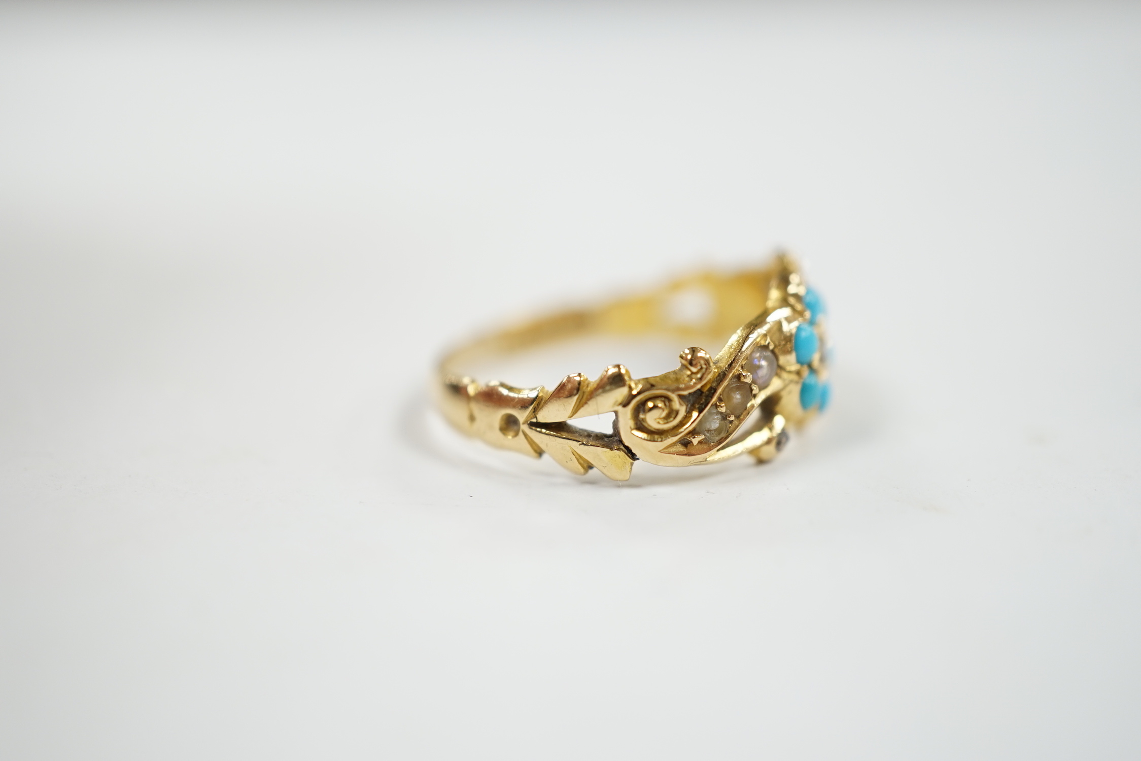 A late Victorian yellow meal, turquoise, rose cut diamond and seed pearl cluster set dress ring, size M, gross weight 3.4 grams.